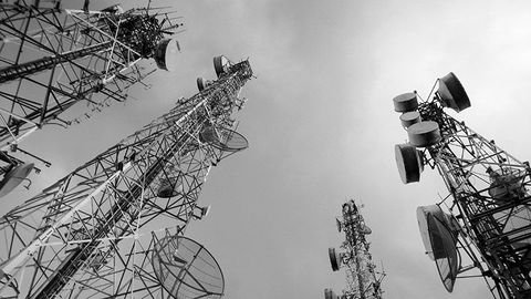 Telecommunication antennas, microwave link dishes and network infrastructure against the sky